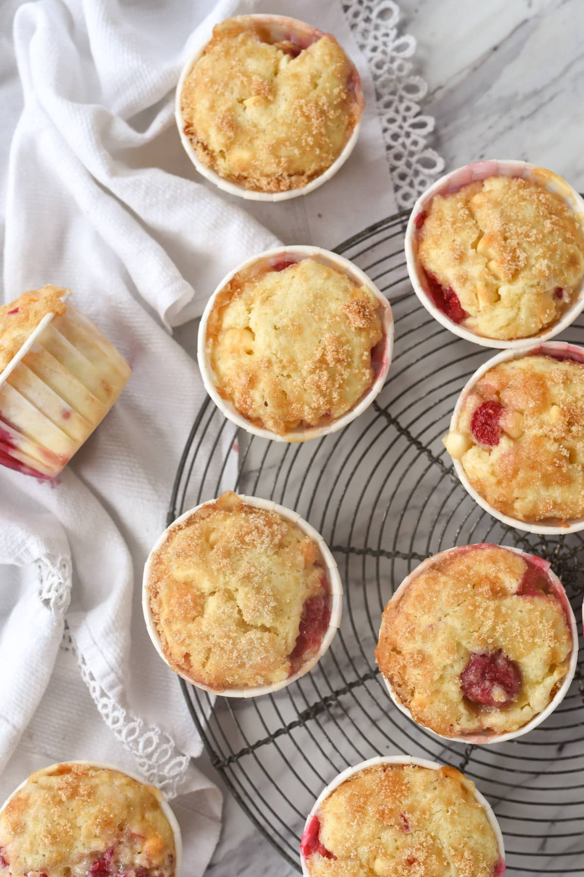 raspberry muffins on a cooling rack