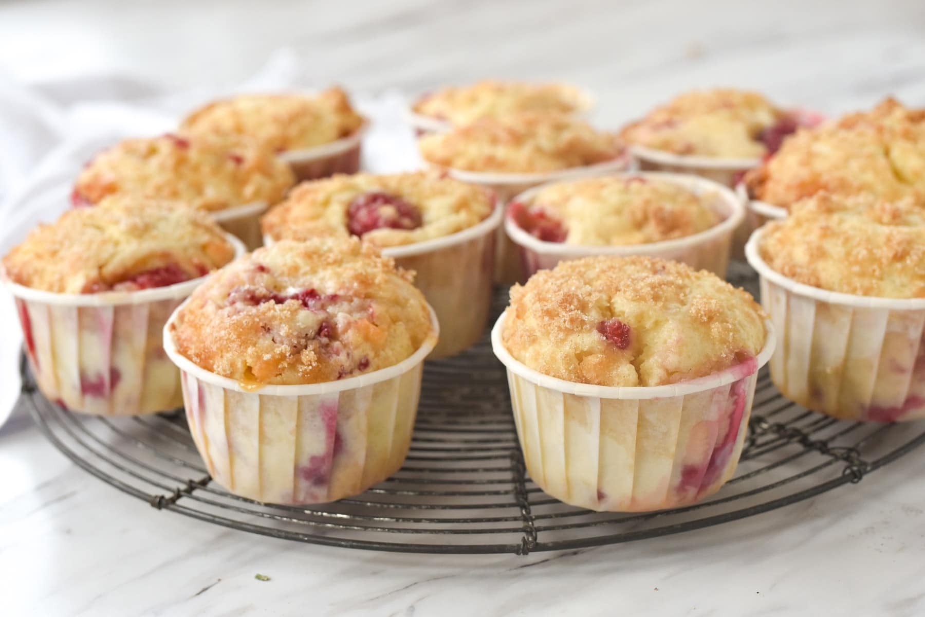 raspberry muffins in white wrappers