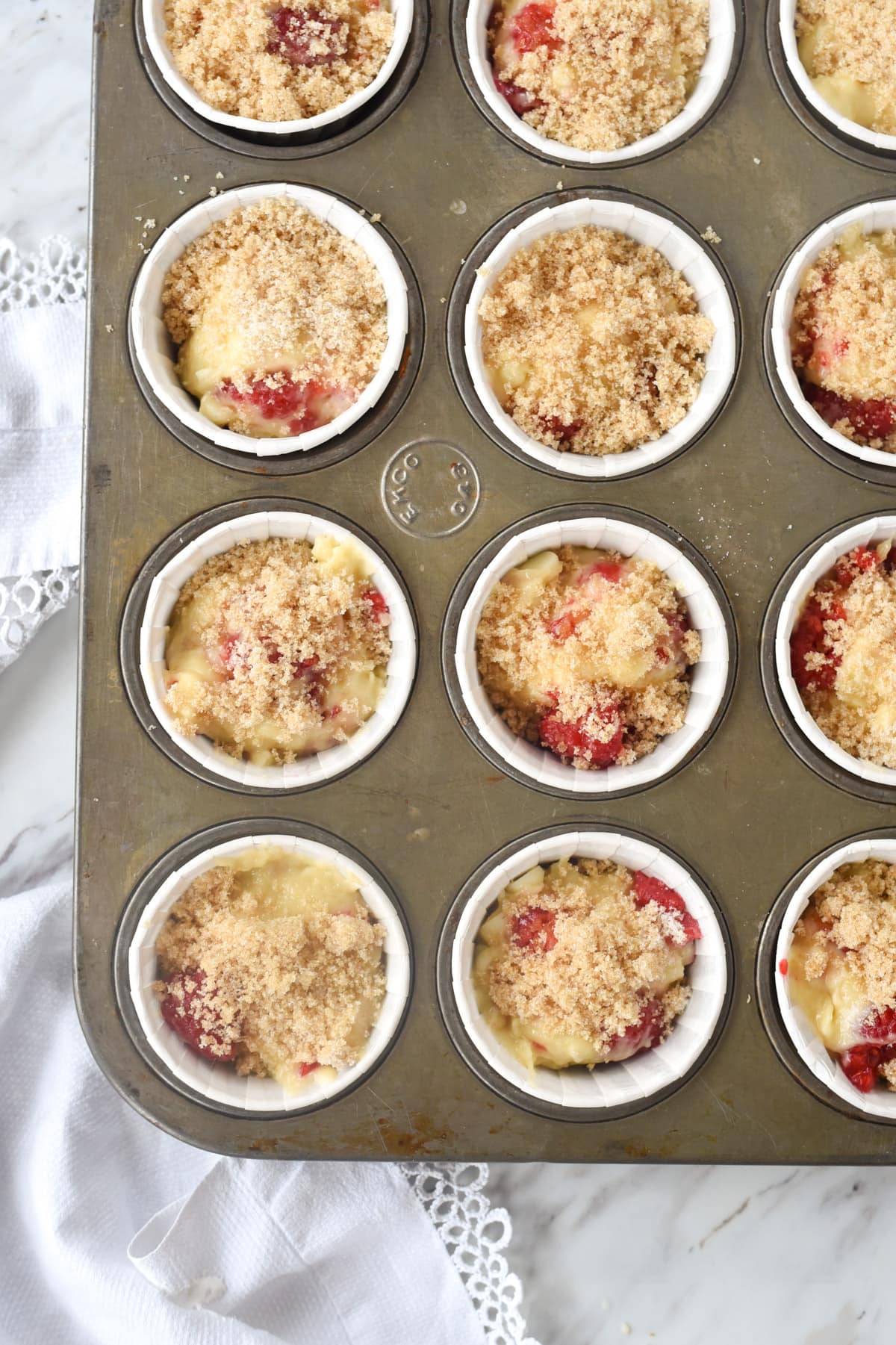 raspberry muffins in a muffin tin