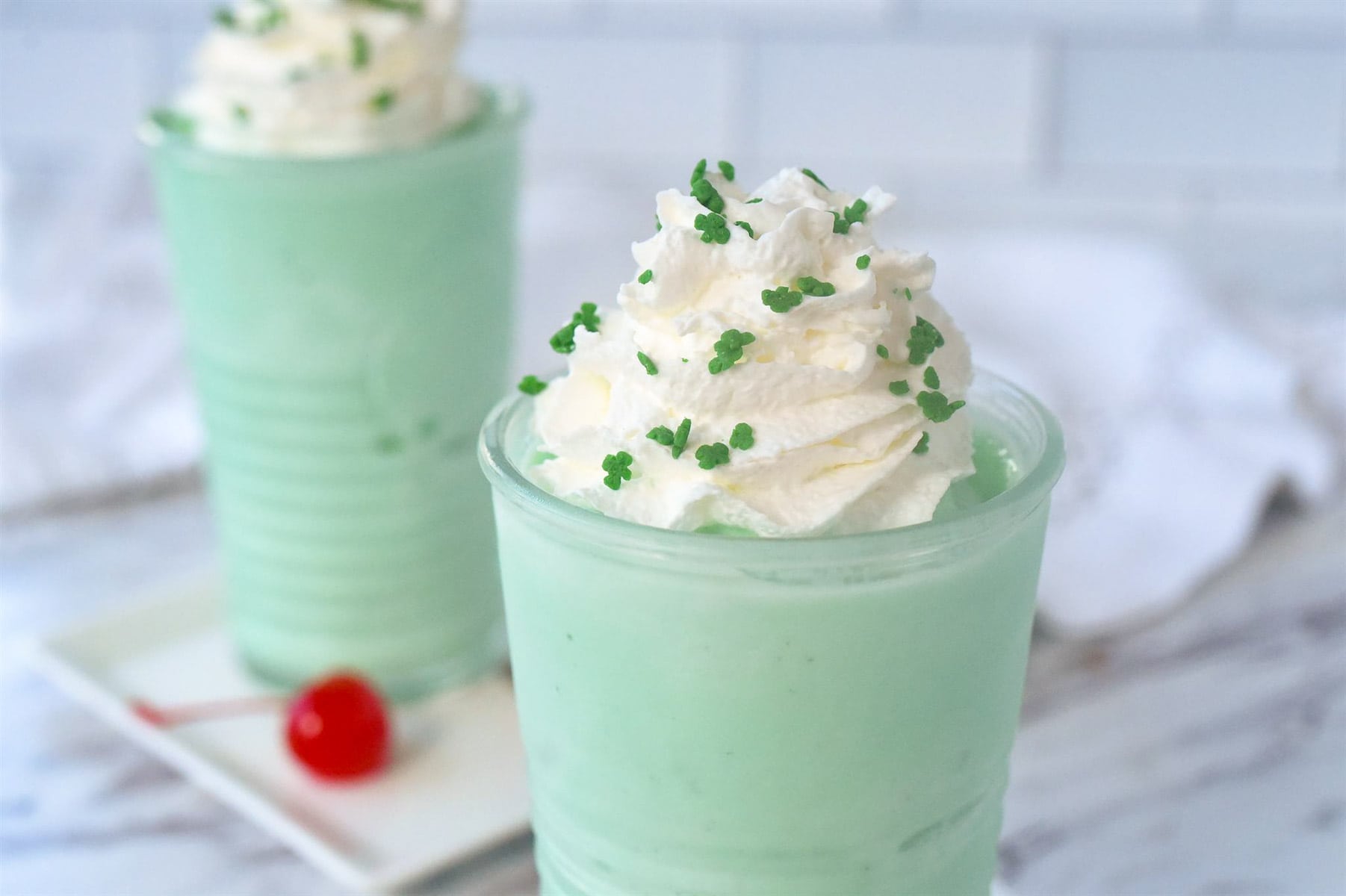 shamrock shakes with whipped cream on top