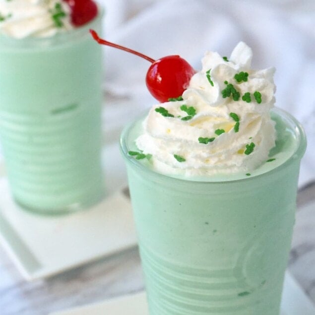 shamrock shake with shipped cream and cherry