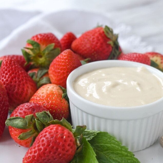 bowl of brown sugar sour cream and strawberries