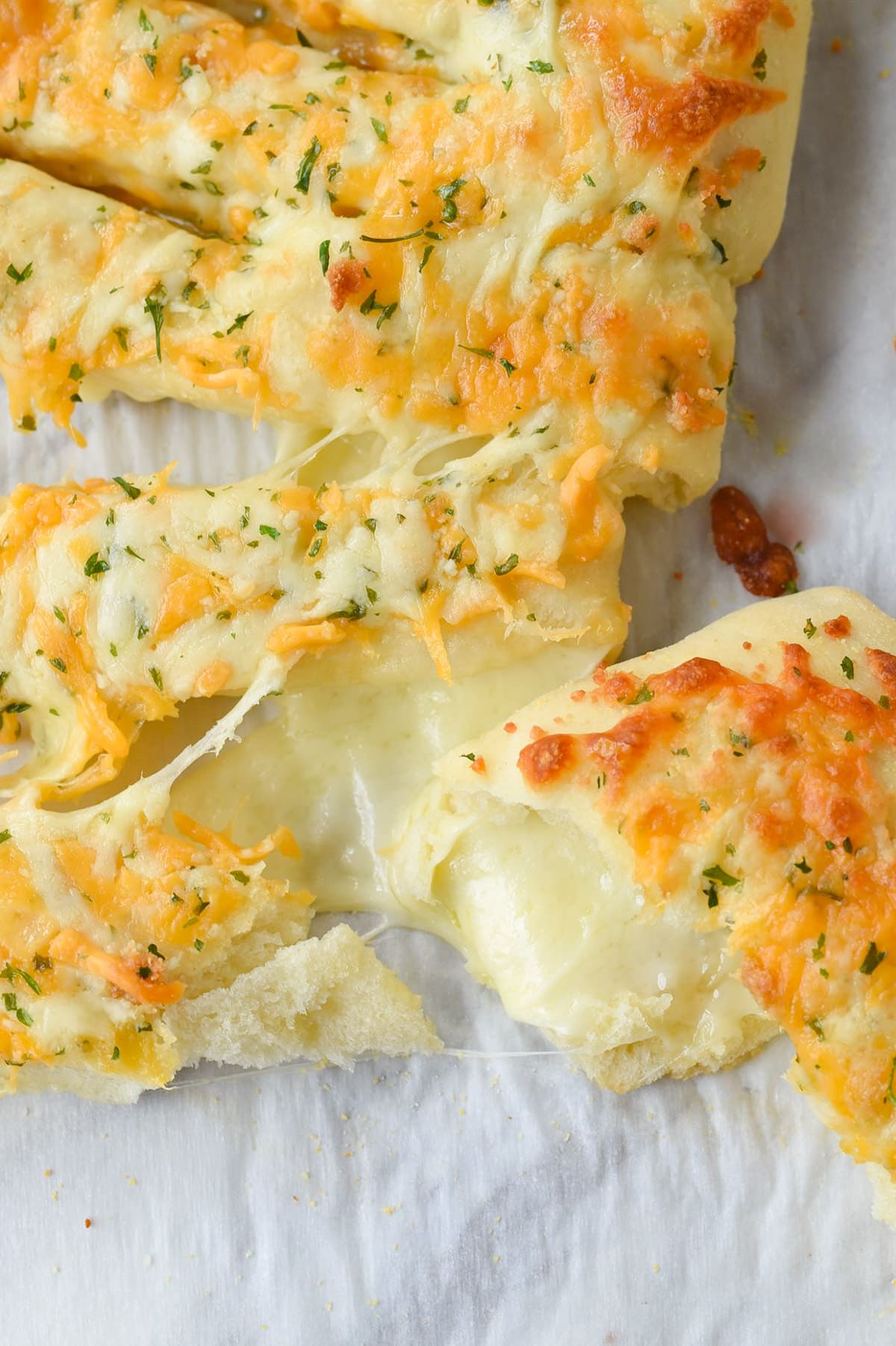 cheese oozing out of a breadstick