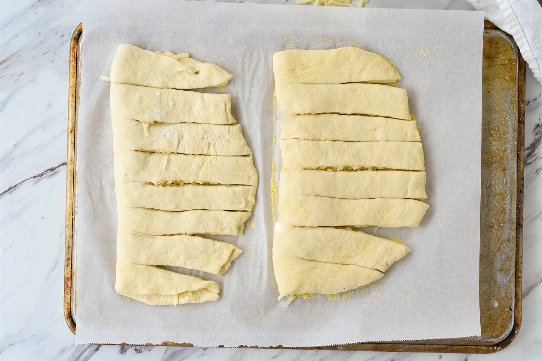 Two pieces of cheey bread sliced