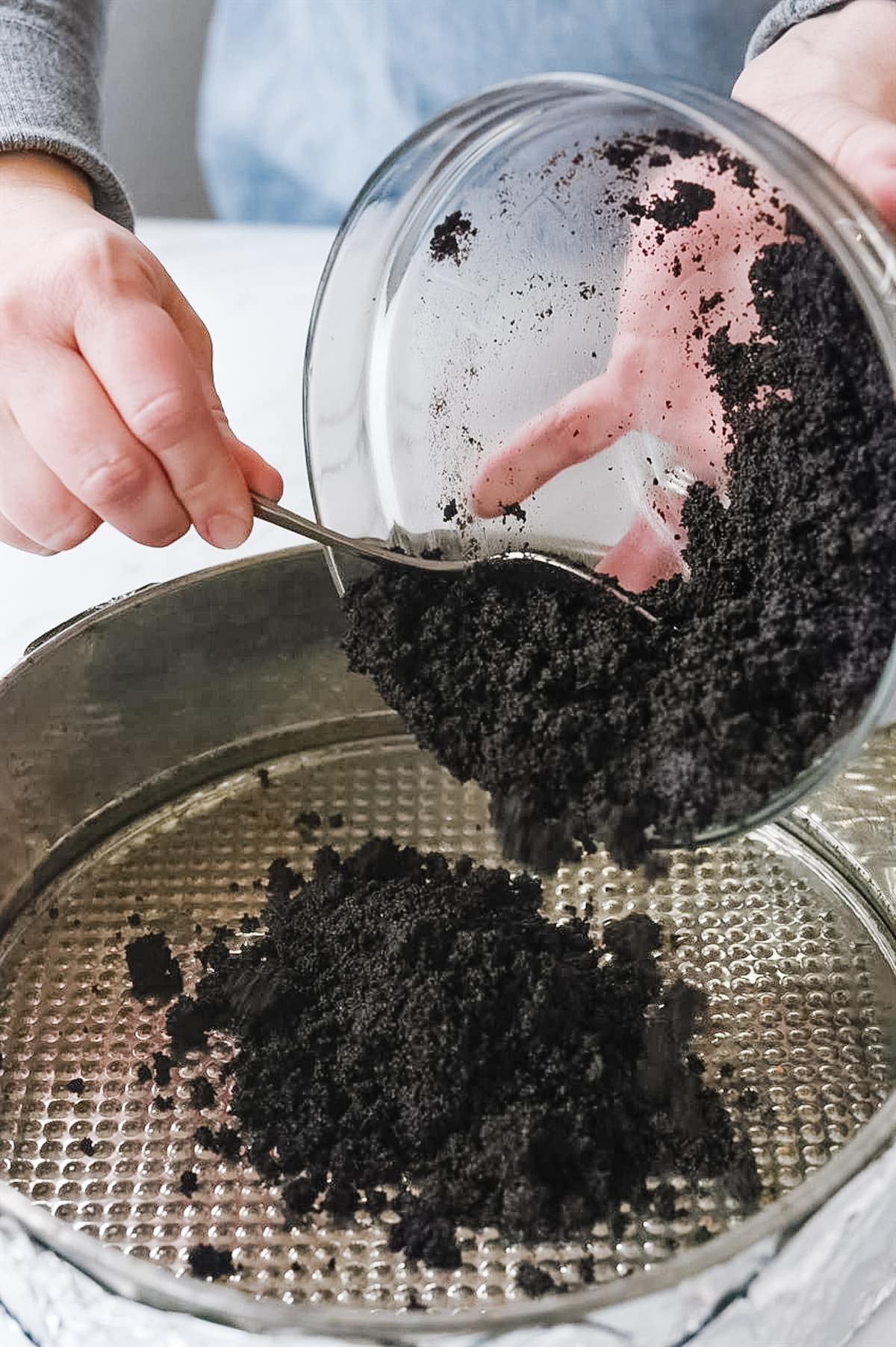 adding cookie crumbs to springform pan