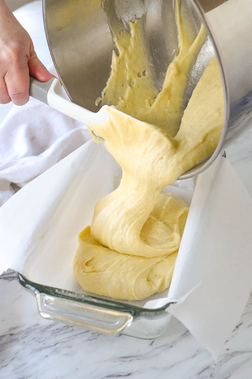 pouring batter into bread pan