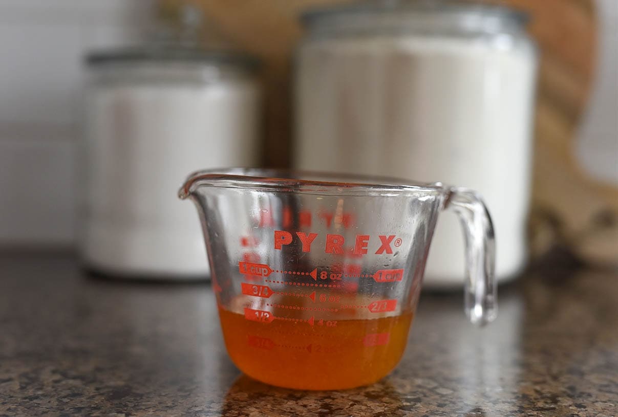 honey in a measuring cup