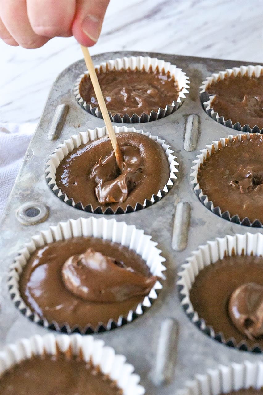 swirling nutella in cupcake