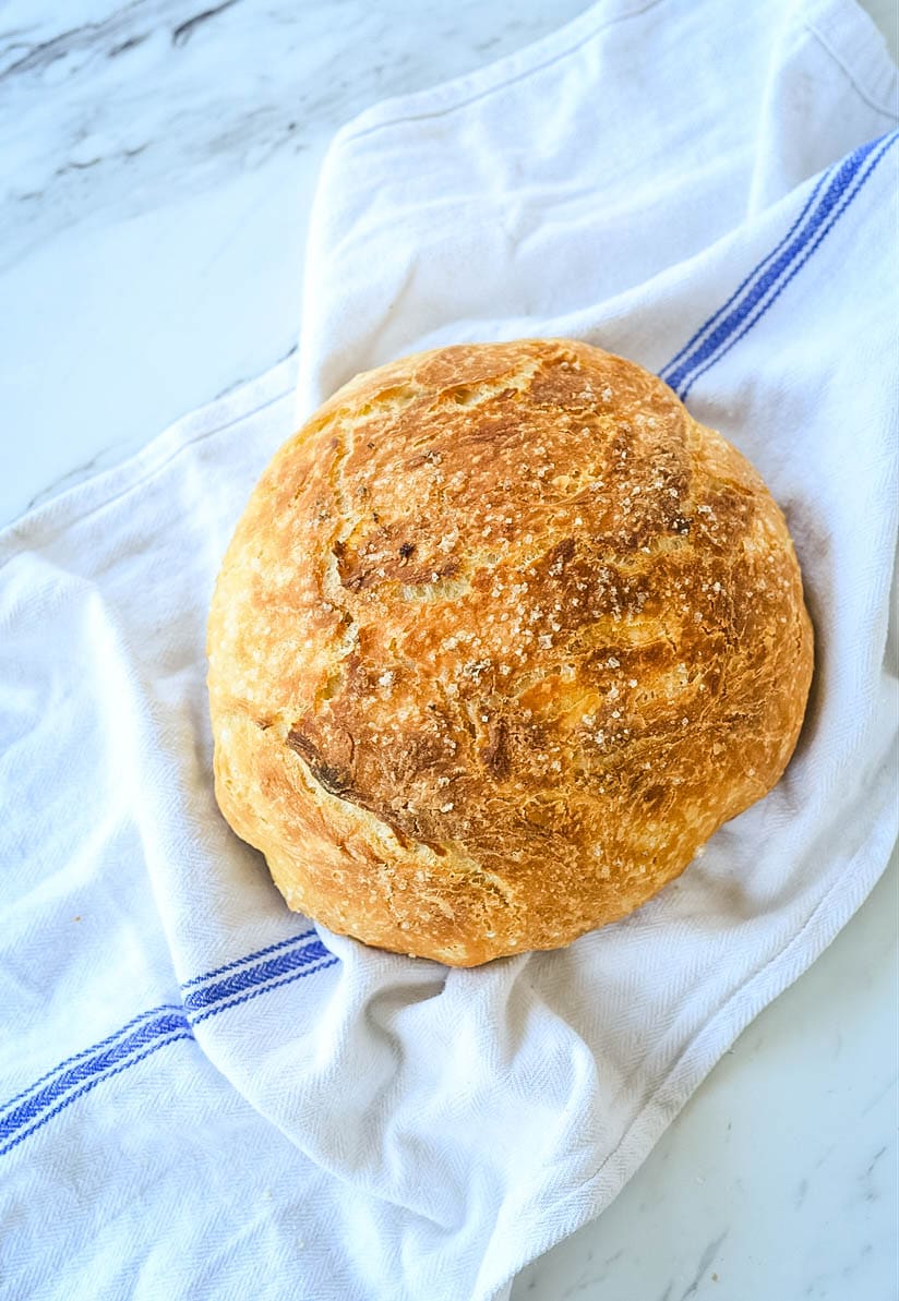 loaf of bread on a kitchen towel