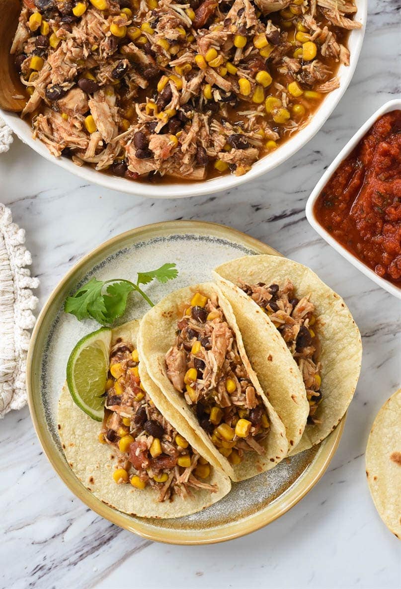 slow cooker salsa chicken overhead shot of salsa chicken tacos