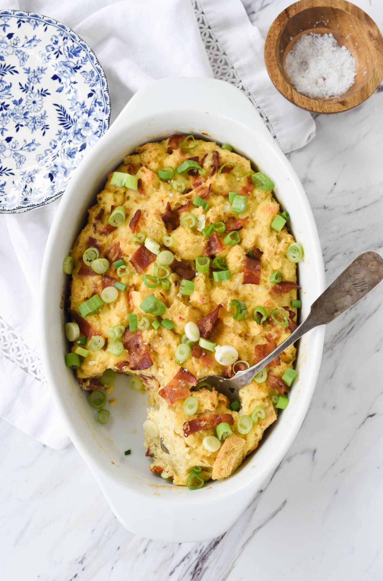 overhead shot of bacon casserole with spoon