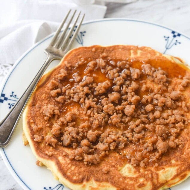 large cinnamon streusel pancake on a plate