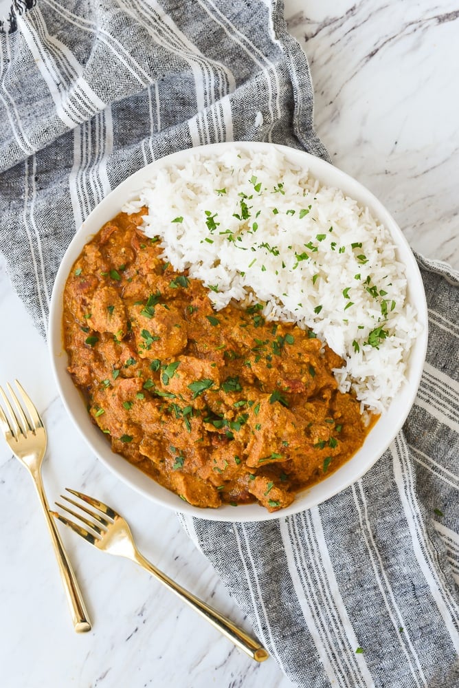 overhead shot of butter chicken in a bowl