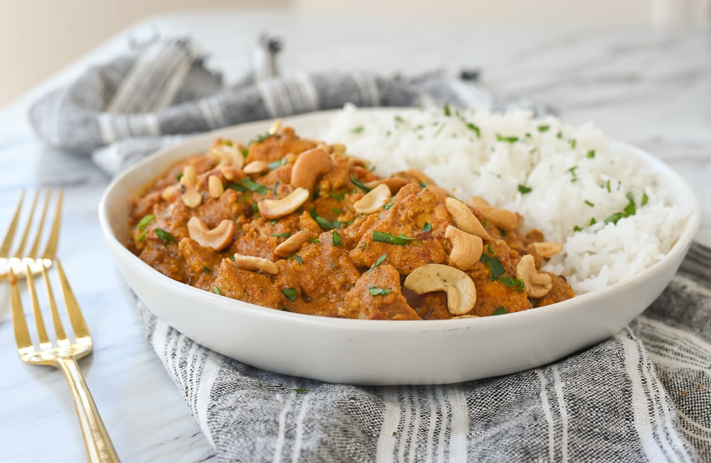 butter chicken with rice in a bowl