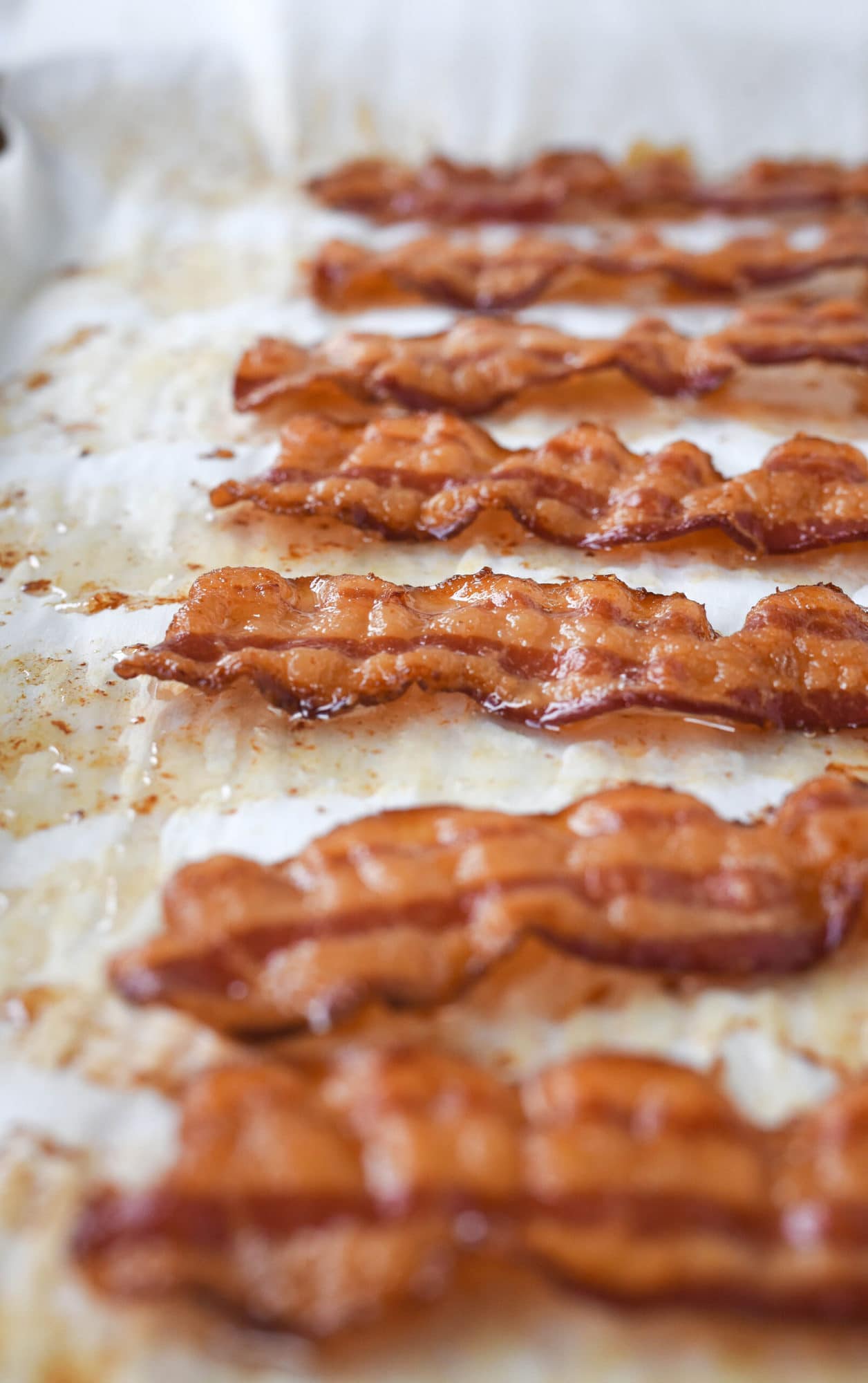 cooked bacon on parchment paper