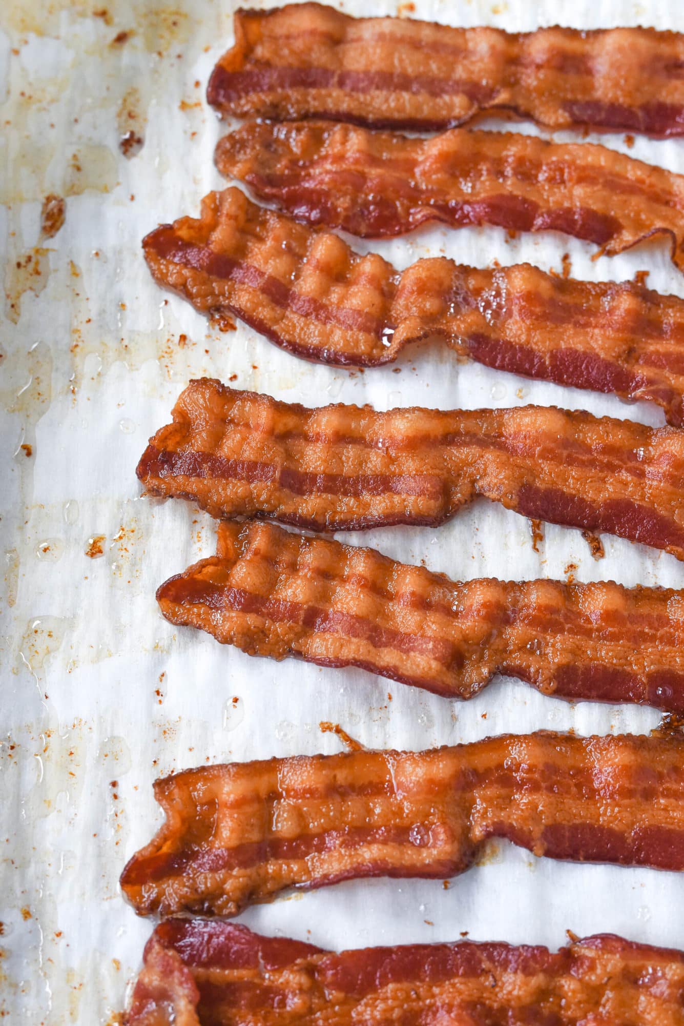 strips of cooked bacon on parchment paper