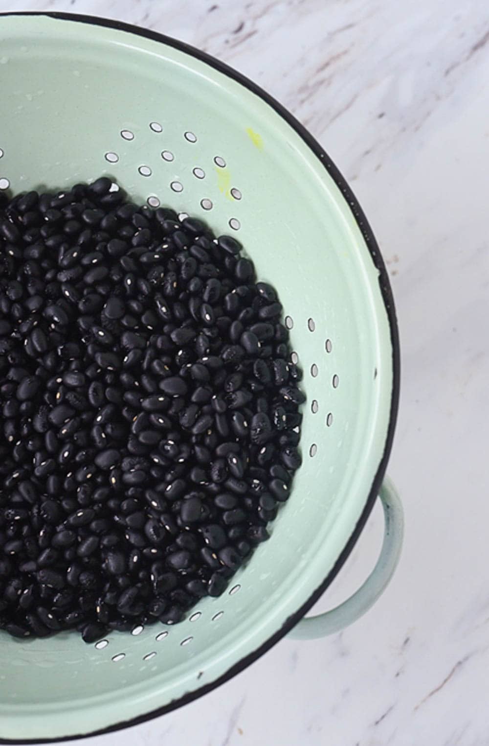 black beans in strainer