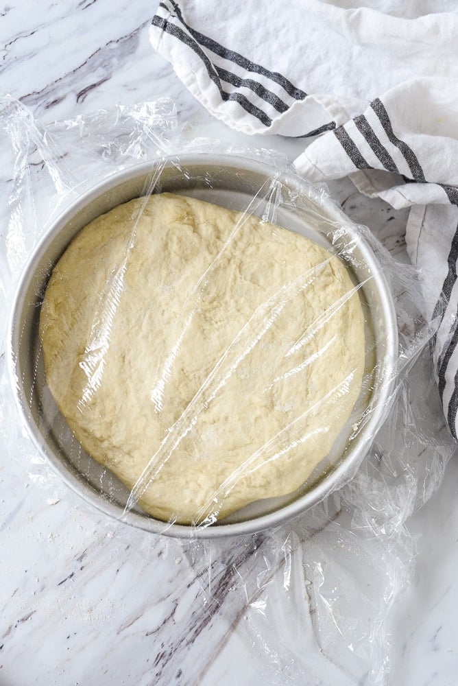 round cake pan full of dough