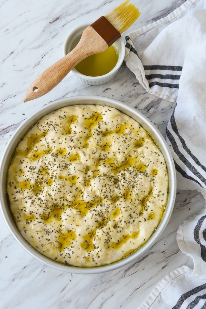 herbs sprinkled on focaccia bread