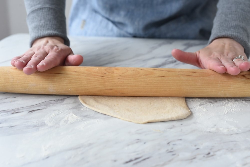 rolling out a pita pocket