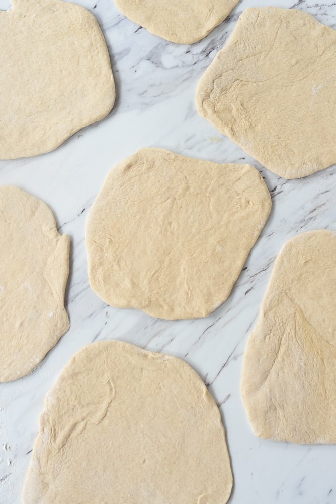 rolled out pita bread dough