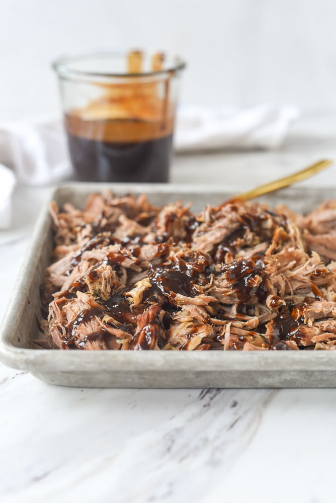 crock pot pulled pork on a baking sheet