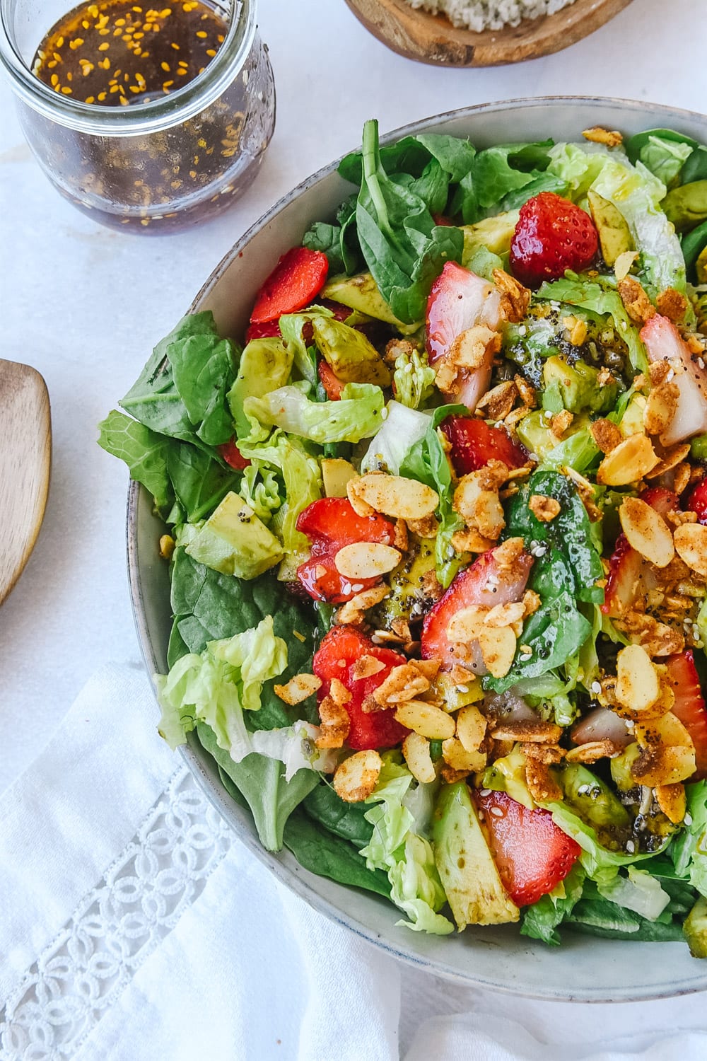 overhead shot of salad with strawberries and avocado