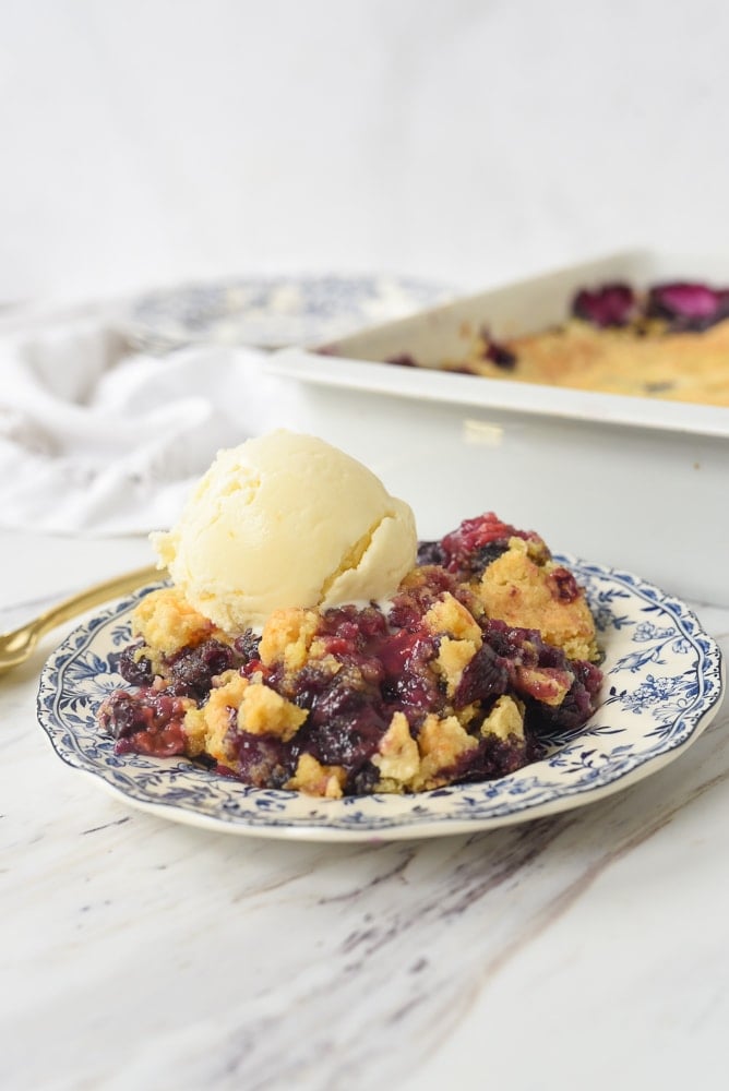 blueberry dump cake on a plate.