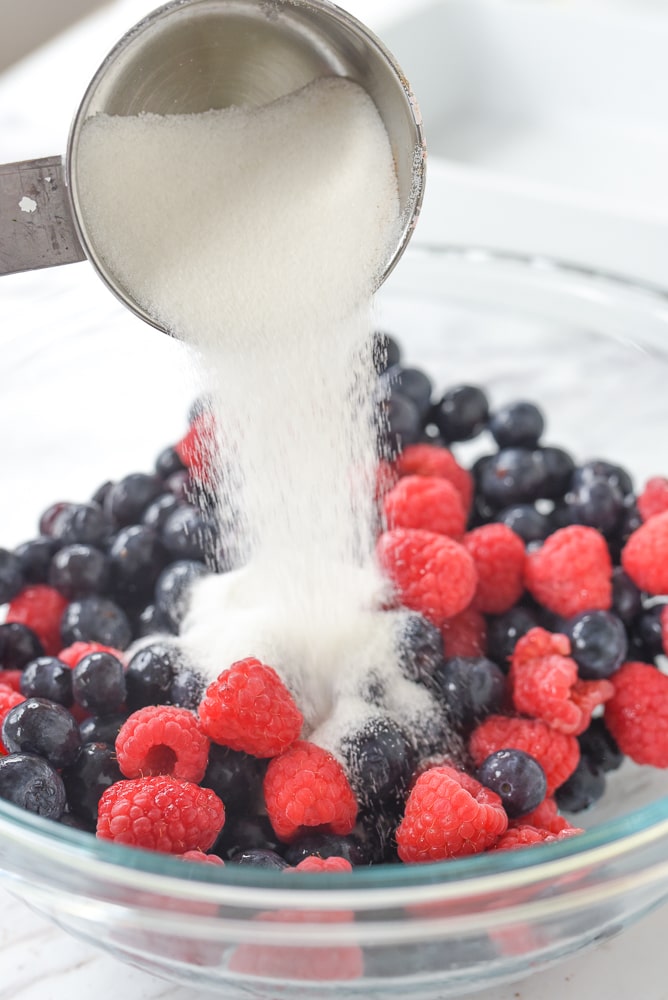 adding sugar to fruit