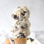 three scoops of ice cream on a cone