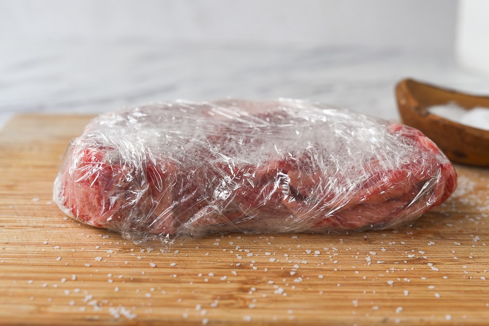 steak wrapped in plastic wrap
