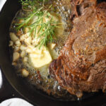 butter in pan with steak