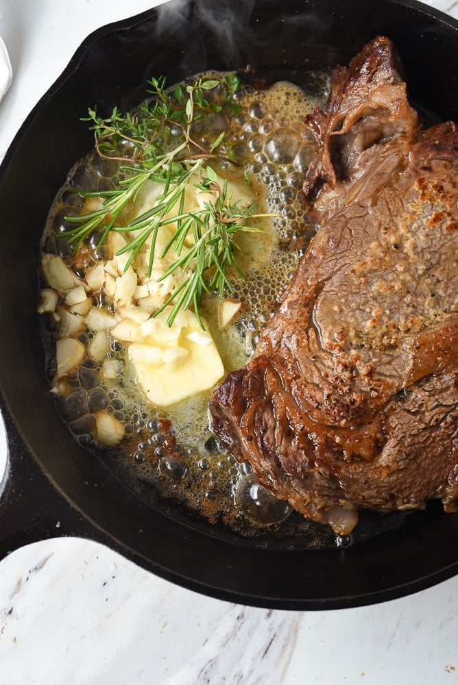 butter in pan with steak