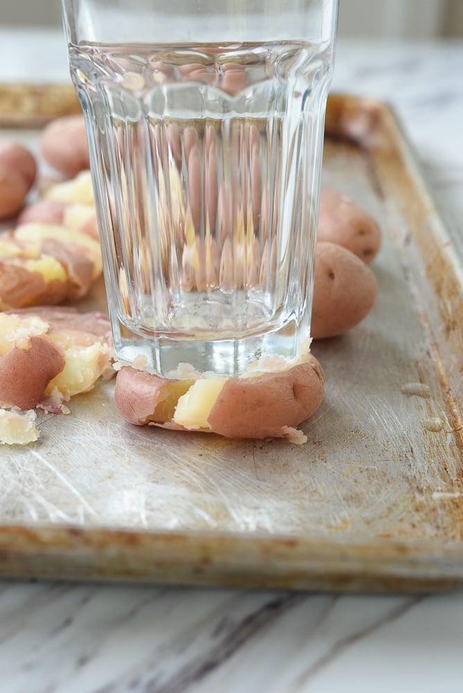 smashed potatoes with a glass