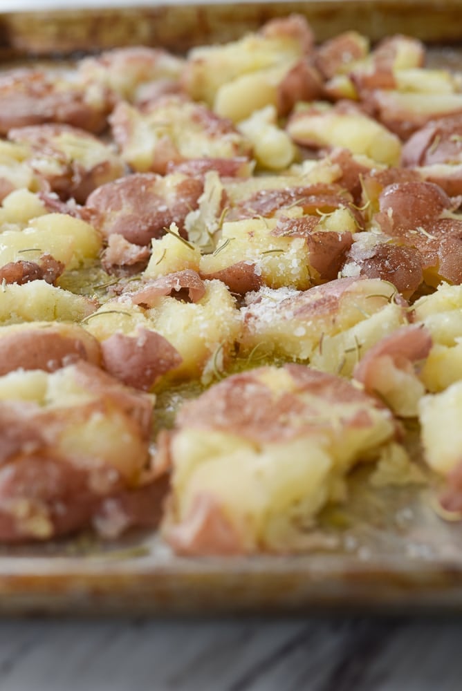 smashed potatoes on a baking sheet