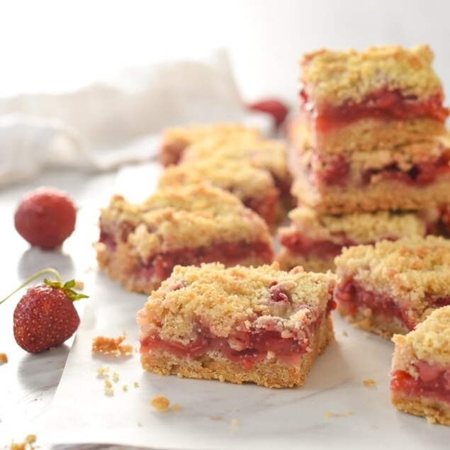 pile of strawberry bars on parchment paper