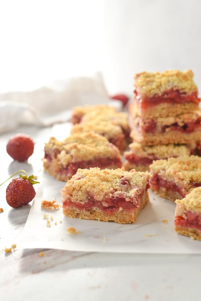 pile of strawberry bars on parchment paper