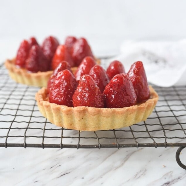 fresh strawberry tart on a cooling rack