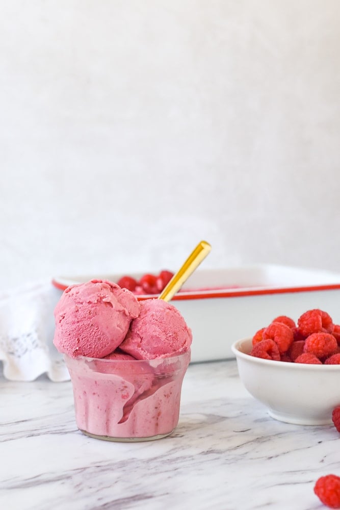 raspberry ice cream with a spoon in it