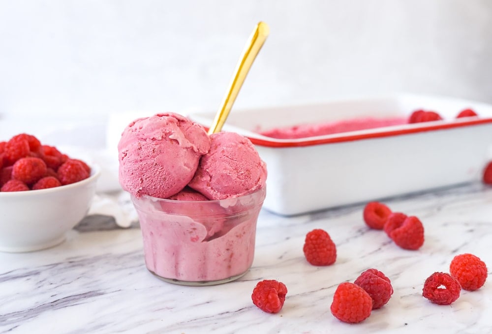 scoops of raspberry ice cream in a dish