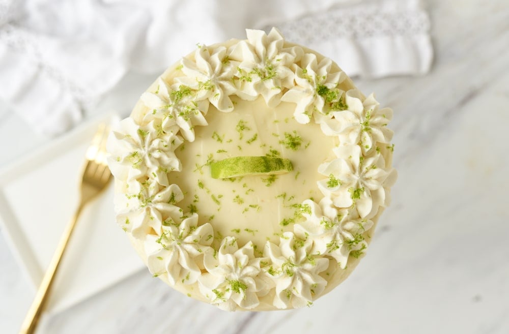 key lime cake with whipped cream on top