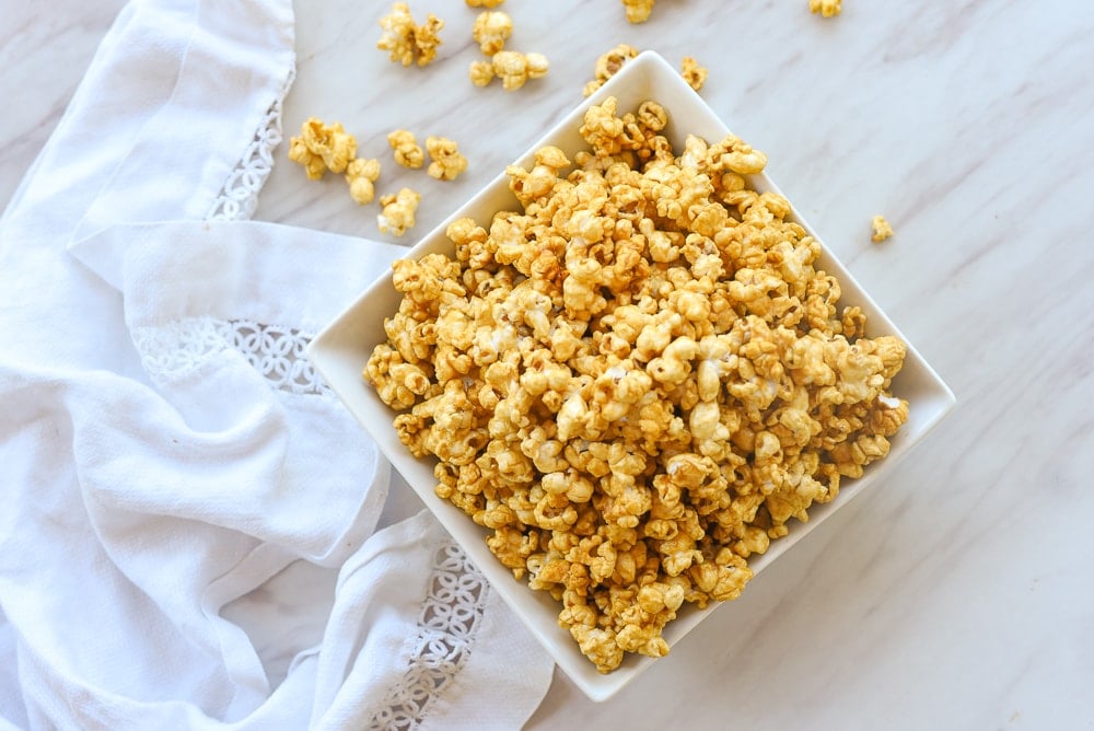 square white bowl of caramel corn