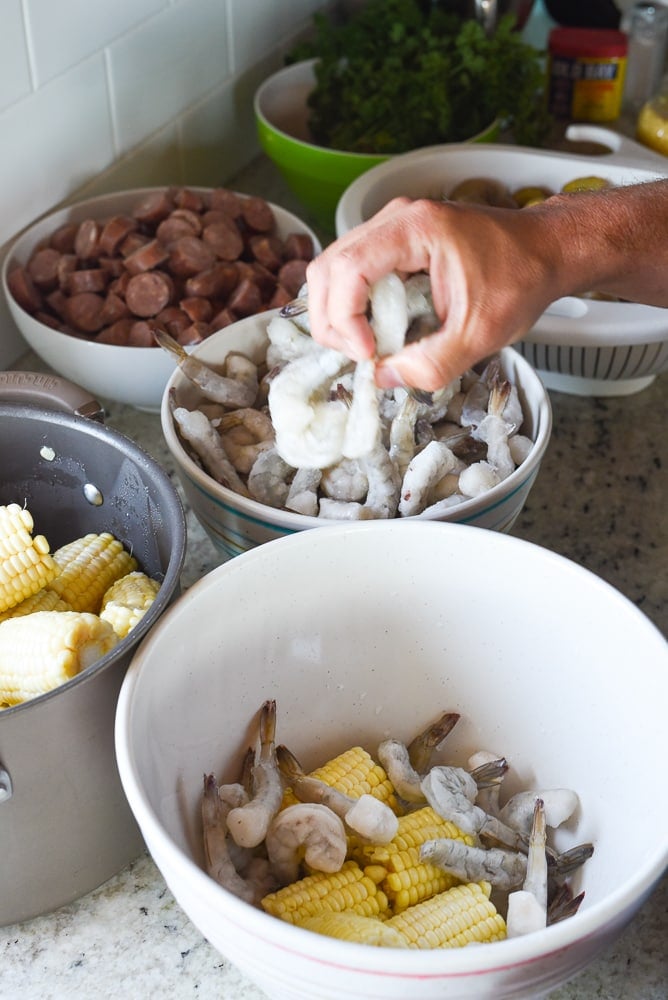 placing shrimp in bowl