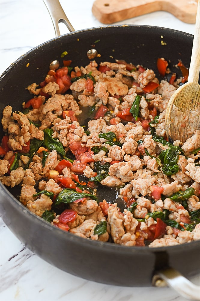 pan of chicken sausage cooking