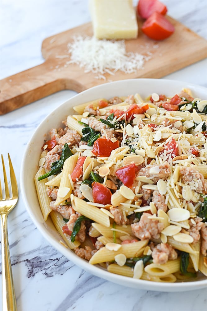 white bowl of chicken sausage pasta