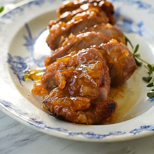 slices of orange glazed pork tenderloin