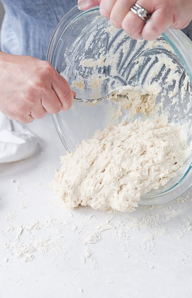 pouring dough onto counter