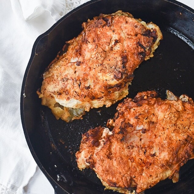 breaded chicken in frying pan