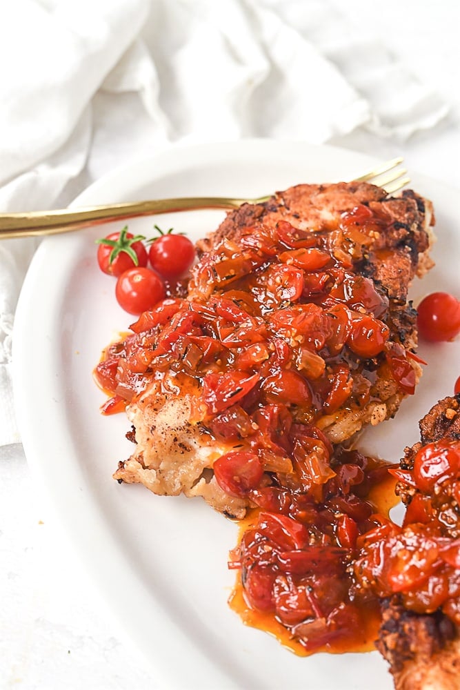 buttermilk chicken with tomato relish on top