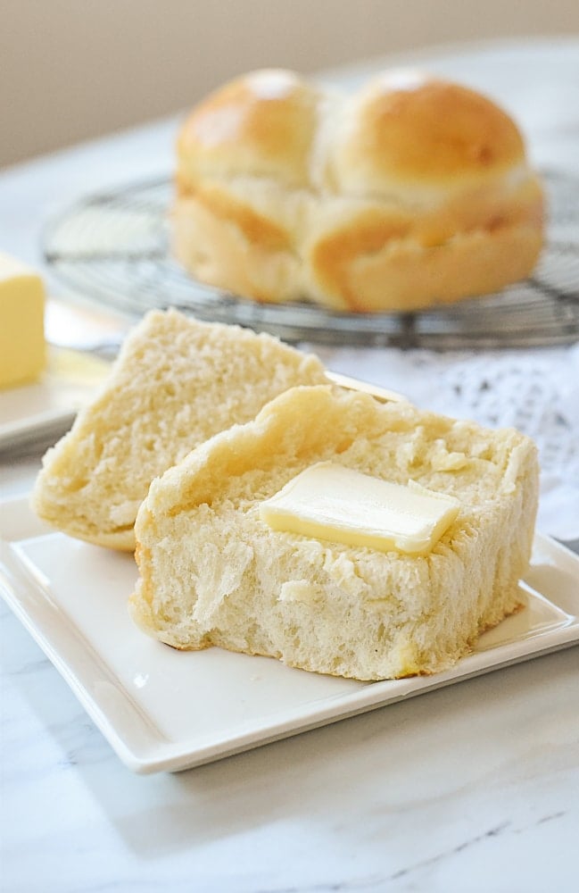 dinner roll with butter on it.